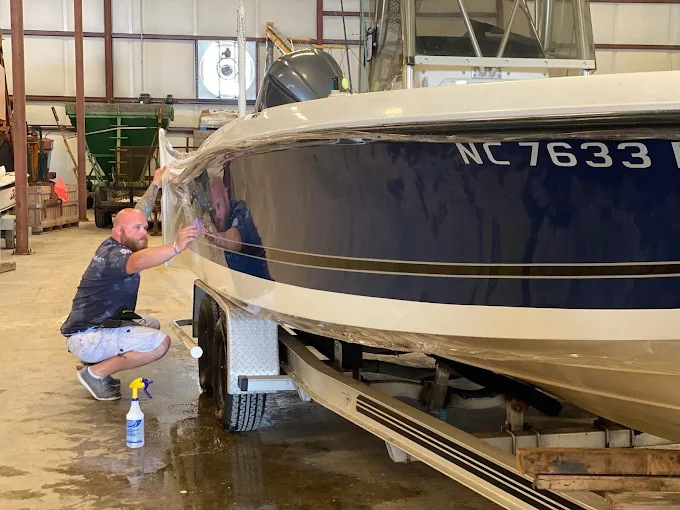Boat hull graphics and protective film installation by Xtreme Shades