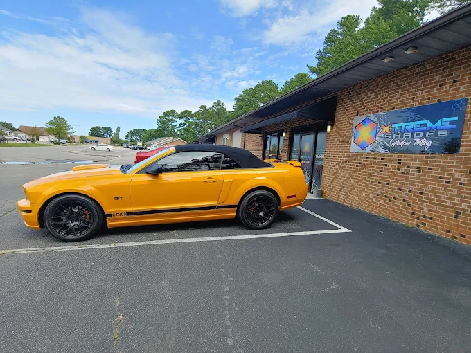 Ford Mustang GT convertible outside the Xtreme Shades storefront