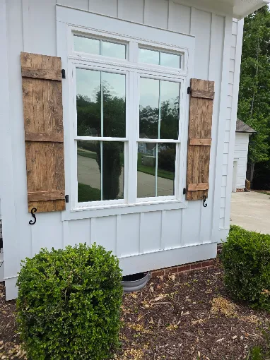 Residential home window with Huper Optik heat rejection film in North Carolina