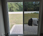 Sliding glass patio door with residential window film reducing glare