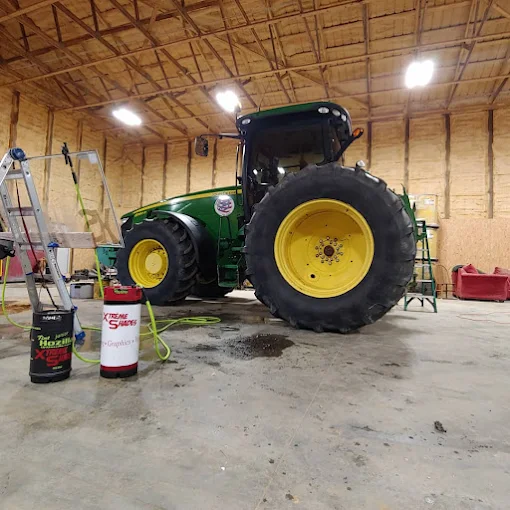 John Deere tractor cab getting window tint installed by Xtreme Shades